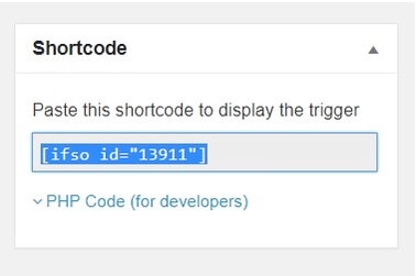 A user interface showing a shortcode for displaying a trigger, with the code `[ifso id="13911"]`. Below is a dropdown labeled "PHP Code (for developers)".