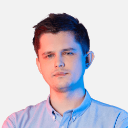 A person with short dark hair in a light blue shirt is looking directly at the camera. The lighting is a mix of red and blue, creating a modern, contrasting effect on the white background.