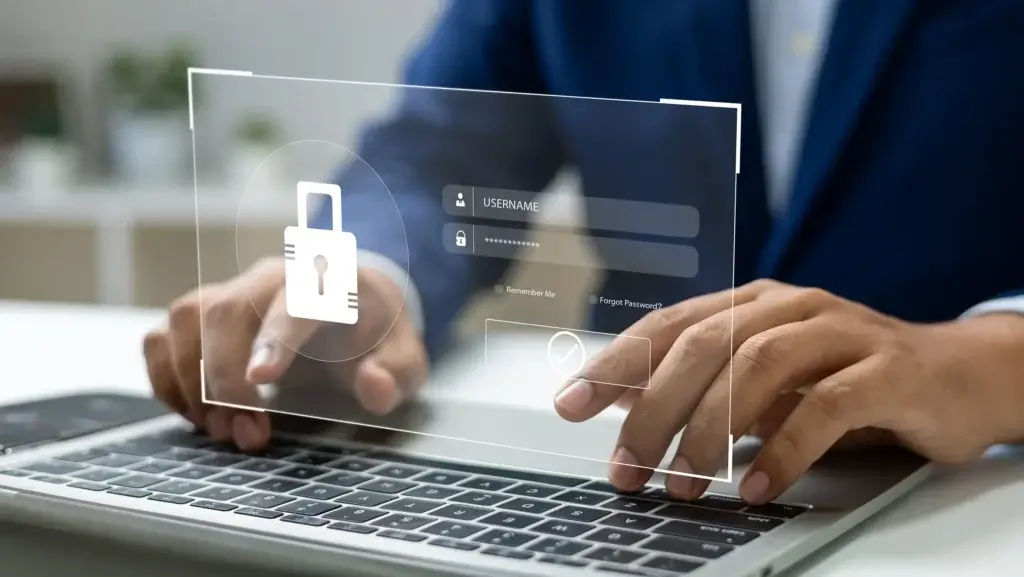 A person in a suit types on a laptop, with a digital overlay showing a login screen and a padlock icon, symbolizing cybersecurity and secure online access.